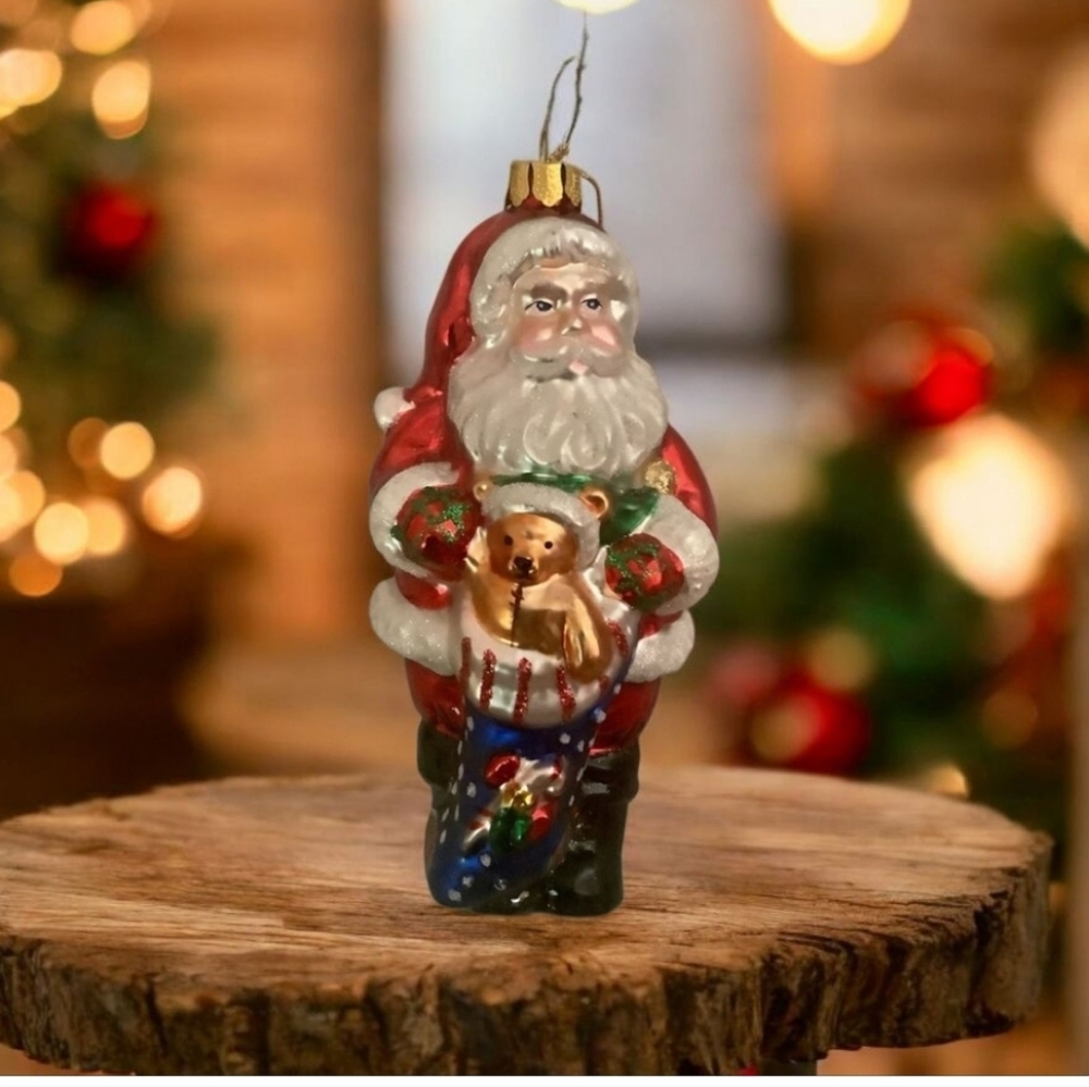 Santa Claus glass Christmas ornament holding teddy bear and a bag of gif…